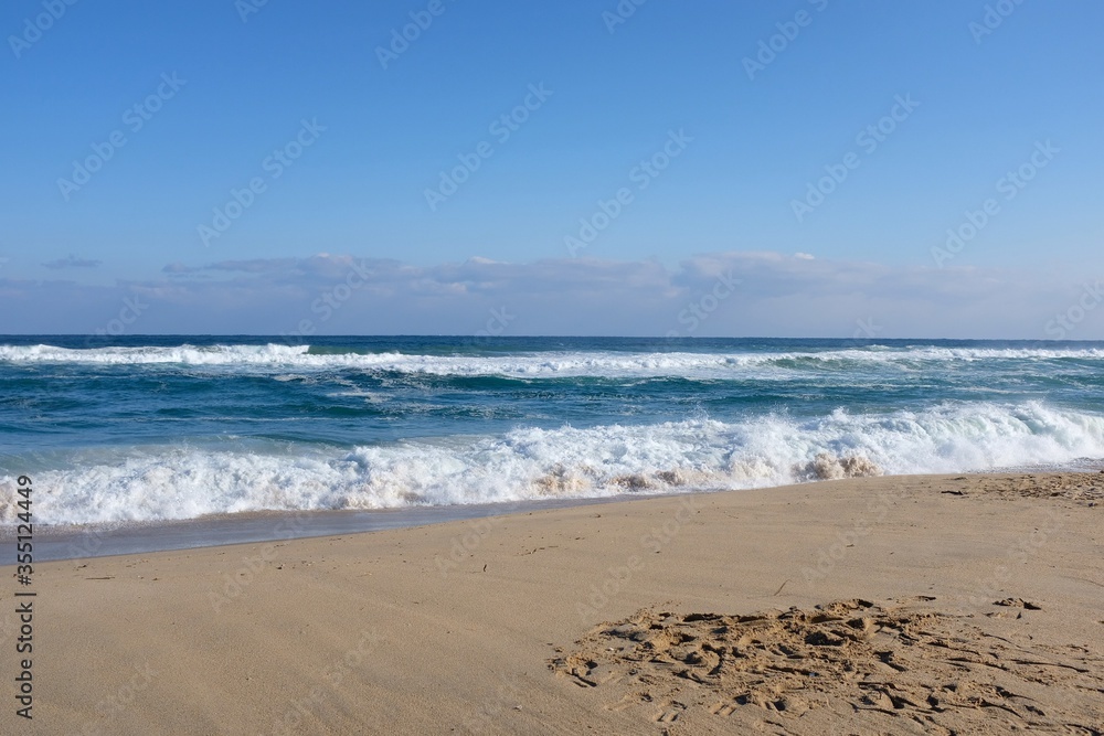 Gangneung/Republic of Korea-December 31, 2019 : Picture taken at Gangmun Beach. There is a sandy beach and a blue sky with a blue sky.