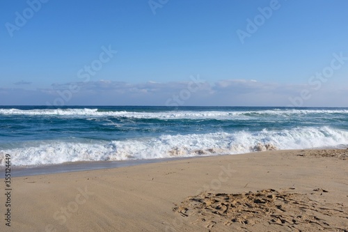 Gangneung/Republic of Korea-December 31, 2019 : Picture taken at Gangmun Beach. There is a sandy beach and a blue sky with a blue sky.
