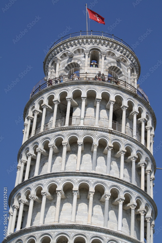 closeup of pisa tower, top part at clear blue sky as backround