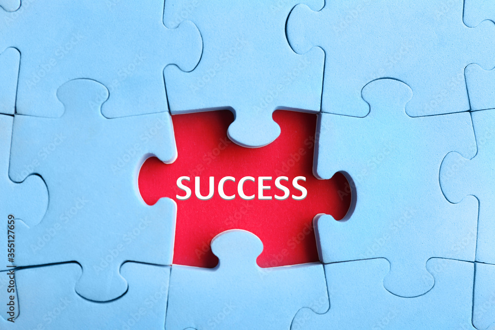 Light blue puzzle with missing piece and word SUCCESS on red background, top view Light blue puzzle with missing piece and word SUCCESS on red background, top view