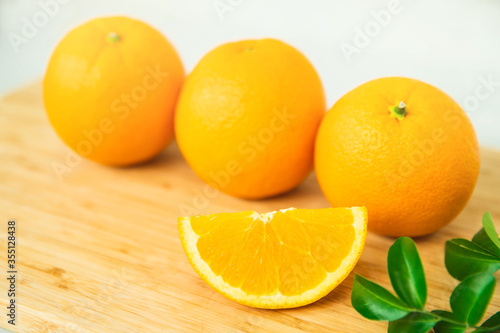 Orange fruit on white background . Healthy food. orange with green leaf on white background.