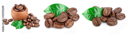 Heap of roasted coffee beans with leaves isolated on white background . Set or collection photo