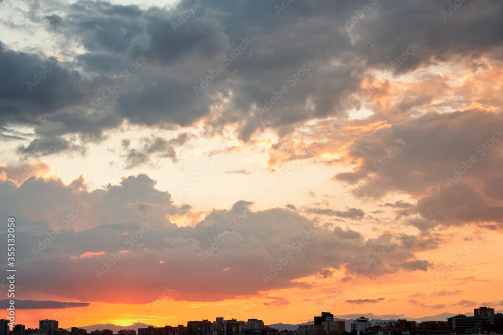 Sunset in the city with some clouds