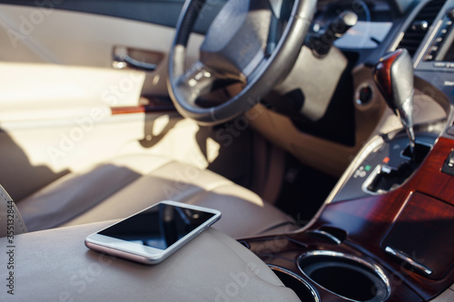 smart phone phone on the car seat dashboard