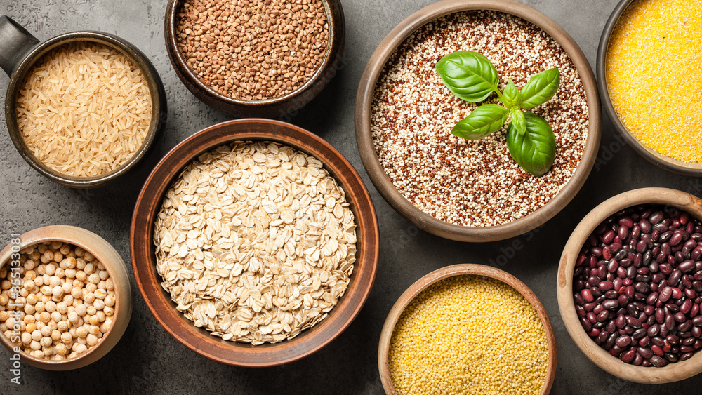 Set with various cereal grains and legumes on stone background Set with various cereal grains and legumes on stone background