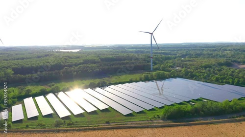 Photovoltaik-Freiflächenanlage mit Windrad Aerial photo