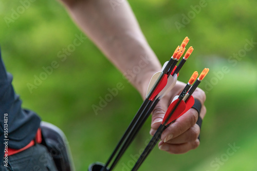pulling an arrow out of the holster at archery races