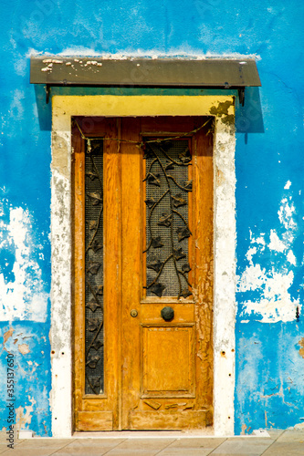 Old traditional door on col...