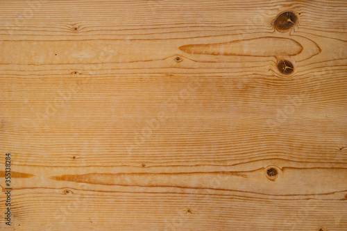 Holz hellbraun Maserung quer mit Astaugen