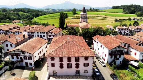 View of traditional houses  and church in Ainhoa, one of  the Most Beautiful Village of France in the Pyrenees Atlantiques. Drone Footage photo