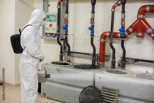 Corona spraying in the sewer collector system of modern tower photo