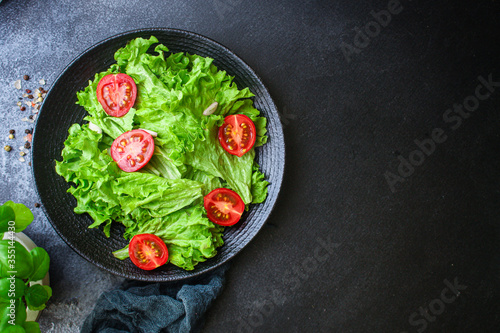 salad vegetables, lettuce and tomato Menu concept. food background top view copy space for text healthy eating keto or paleo diet 