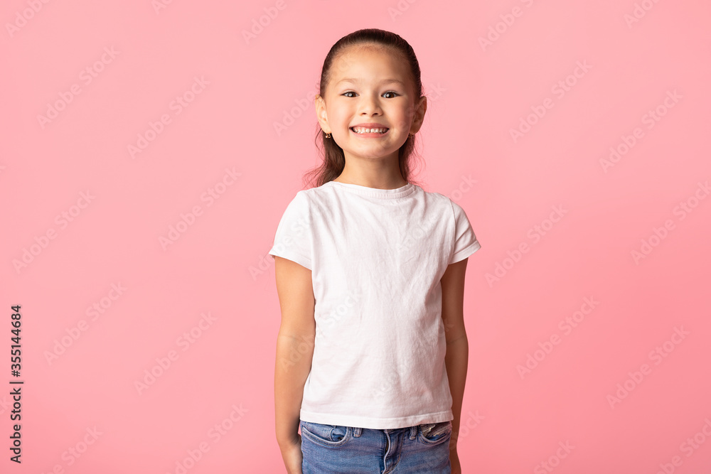 Happy asian girl posing and looking at camera Happy asian girl posing and looking at camera