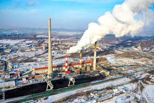 Pipe with smoke. Heat energy network. CHP. combined heat and power, a system in which steam produced in a power station as a byproduct of electricity generation is used to heat nearby buildings.