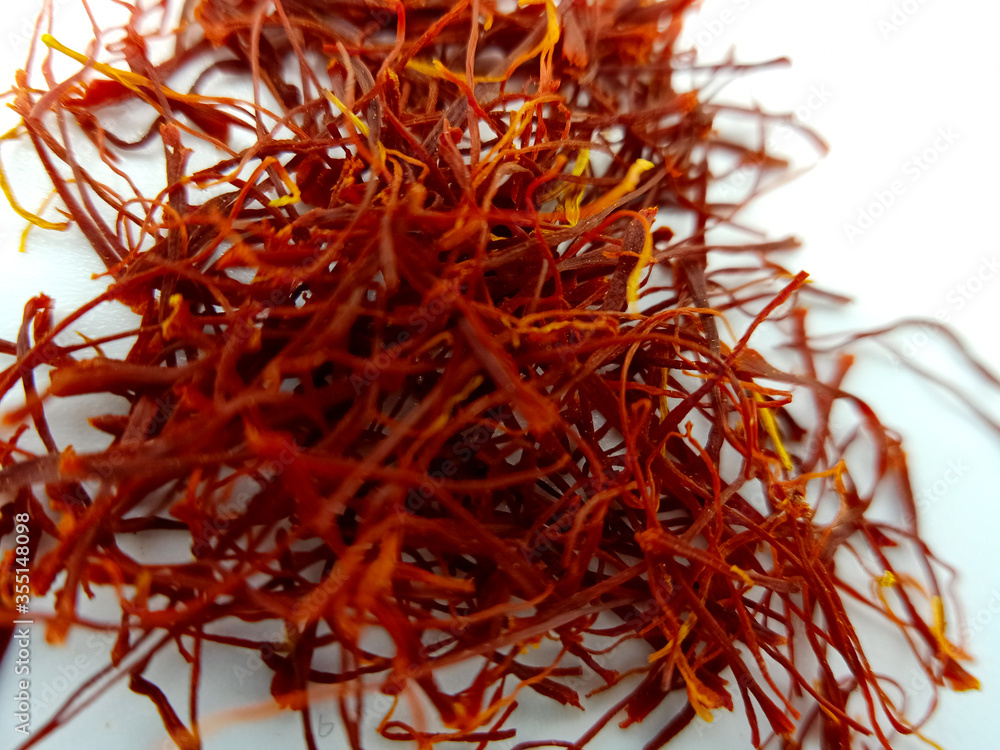 Fototapeta premium saffron on white background, kesar, crocus, saffron background, pile of saffron,