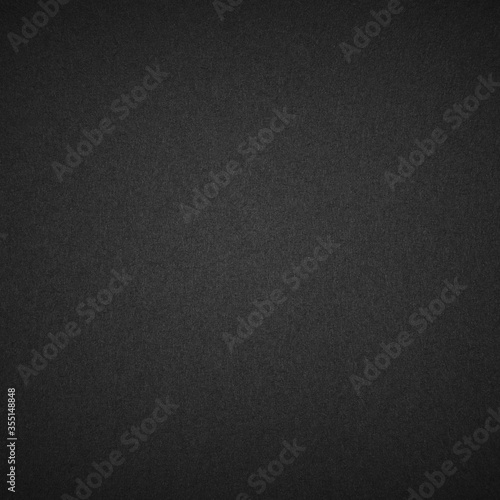 black paper texture or background.