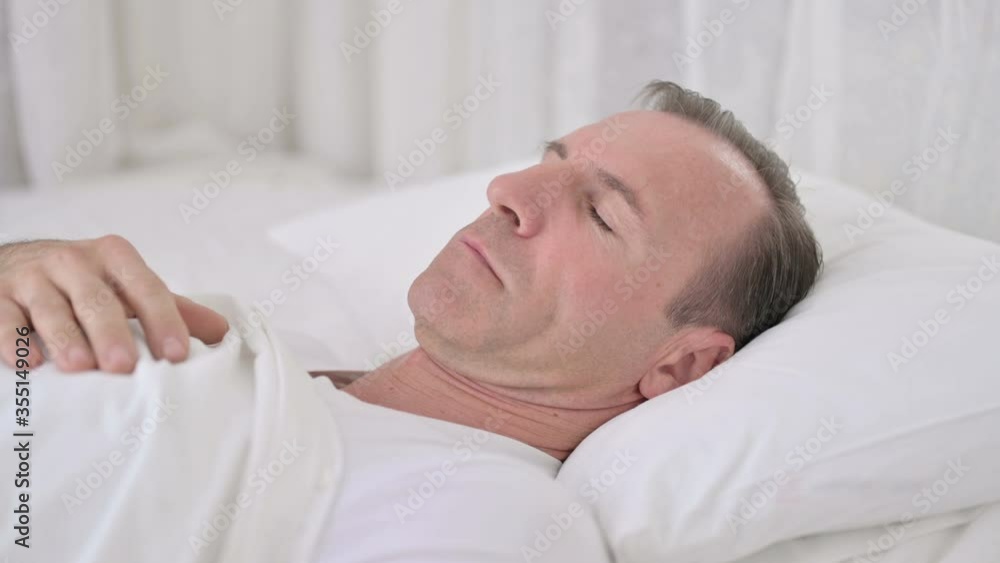 Comfortable Middle Aged Man Sleeping in Bed Comfortable Middle Aged Man Sleeping in Bed