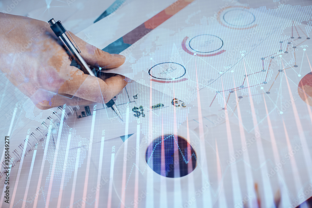 Multi exposure of man planing investment with stock market forex chart. Multi exposure of man planing investment with stock market forex chart.
