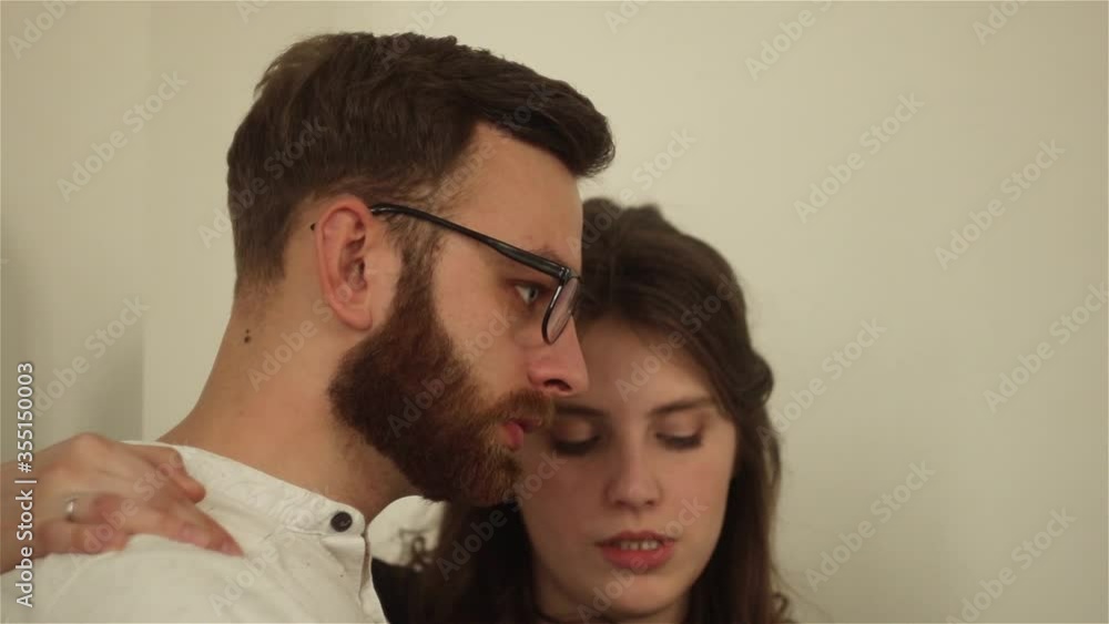 Close-up of young beautiful couple sitting , talking and laughing at home. woman and woman having relationships. Love and touching story. Romantic moments Close-up of young beautiful couple sitting , talking and laughing at home. woman and woman having relationships. Love and touching story. Romantic moments