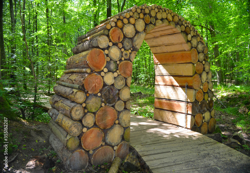 Wooden arch in a forest road in the forest of Gisselfeld Klosters. Denmark photo