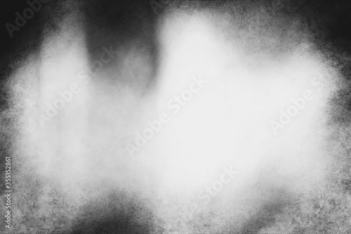 Black and white eerie grunge texture or background with space for text or image.