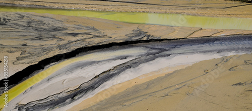 abgetragener Bodensatz (Kalk, Lehm, Schlamm) in einem Kalksteinbruch - removed sediment (lime, clay, sludge) in a limestone quarry photo