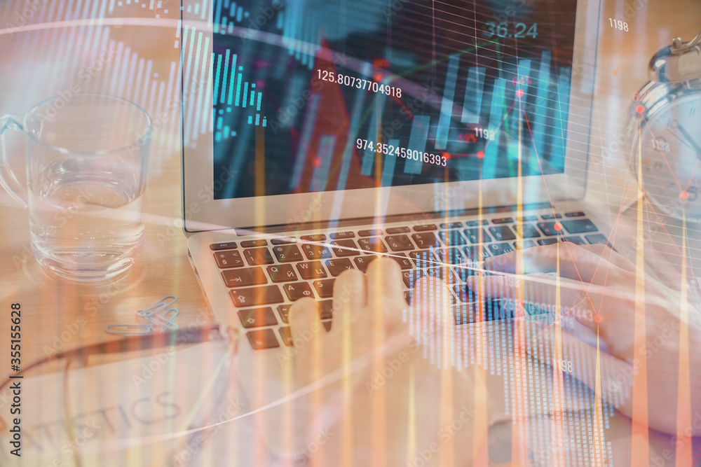 Multi exposure of market chart with man working on computer on background. Concept of financial analysis. Multi exposure of market chart with man working on computer on background. Concept of financial analysis.