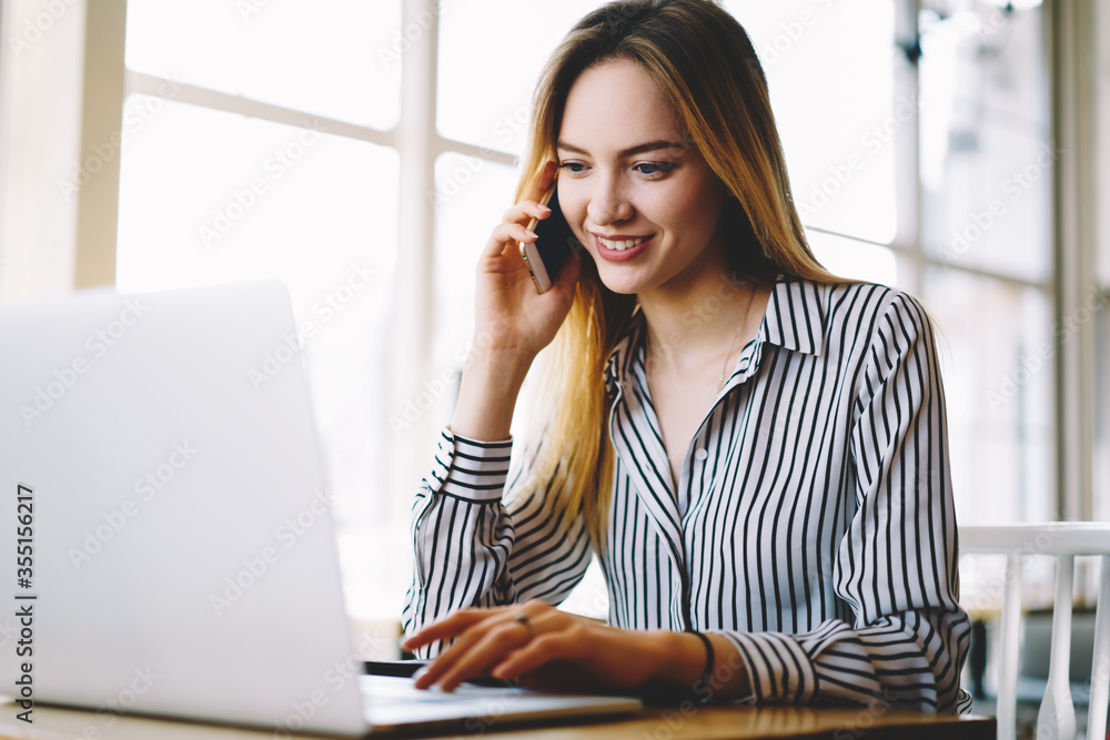 Attractive smiling hipster girl making shopping online in web store confirming booking making phone call to operator service, professional HR manager making job offer having mobile conversation Attractive smiling hipster girl making shopping online in web store confirming booking making phone call to operator service, professional HR manager making job offer having mobile conversation
