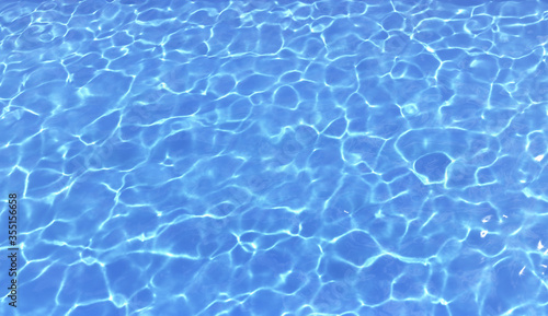 Blue clear water in swimming pool. 