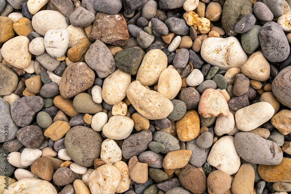 Sea pebbles. Small stones gravel background texture. A pile of pebbles on the beach. Texture, background for designer Sea pebbles. Small stones gravel background texture. A pile of pebbles on the beach. Texture, background for designer