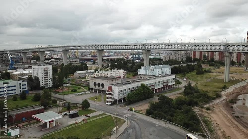 4K aerial early morning sunrise drone video of beautiful Gulf of Finland bay view of commercial port area at ZSD highway high-columns overpass bridge, Kanonerskiy Island, St.Petersburg, Russia photo