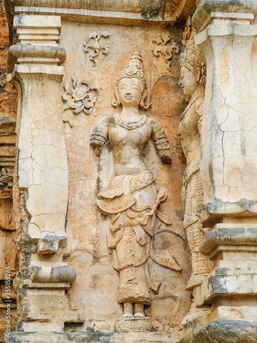 view of ancient buddha sculpture on brick wall of ruin temple, Wat Chet Yot or officially called Wat Photharam Maha Wihan in Chiang Mai City, northern of Thailand.