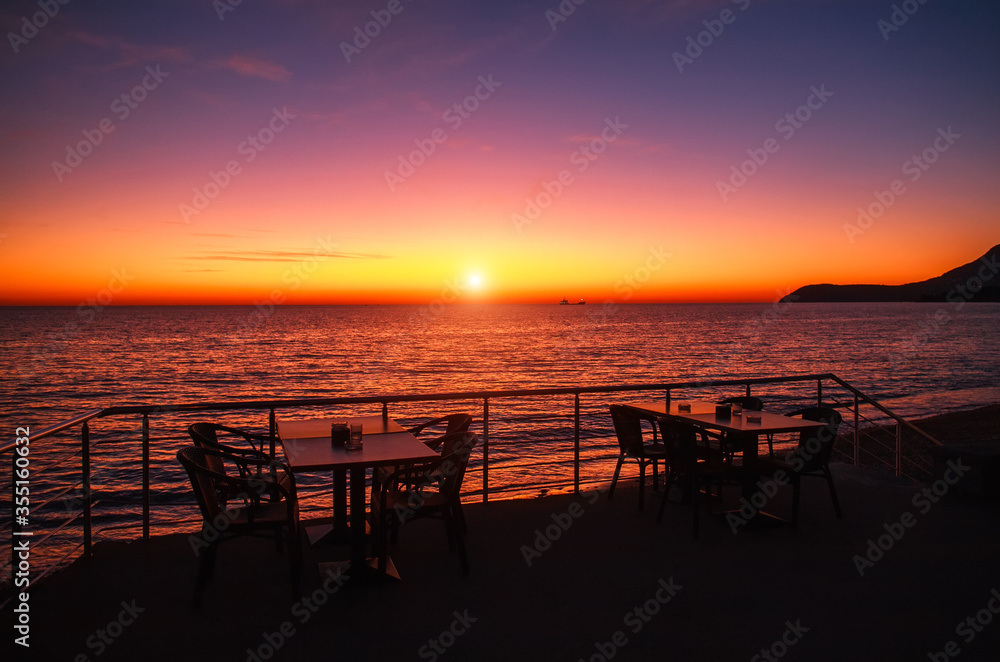 Spectacular romantic sunset on Mediterranean coast, clouds in colorful sky, Bar, Montenegro Spectacular romantic sunset on Mediterranean coast, clouds in colorful sky, Bar, Montenegro