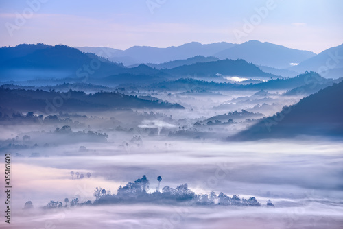 Beautiful Landscape of mountains and forest in early morning sun rays and fog near village Ngapali, Myanmar