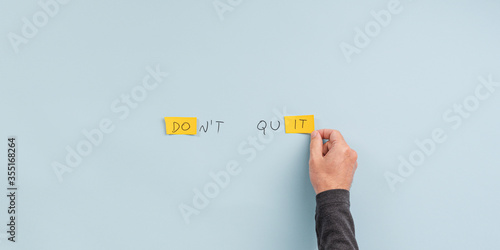 Male hand making a dont quit sign