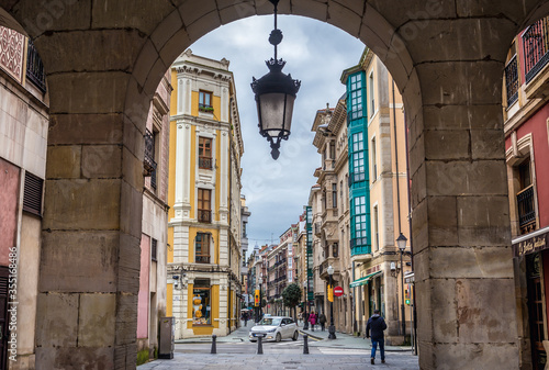 San Bernardo Street seen from Main Square of historic part of Gijon city in northwestern Spain photo