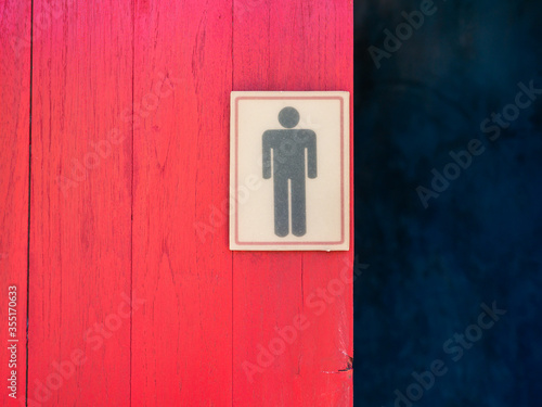 Male Toilet Symbol on The Red Wooden Door photo