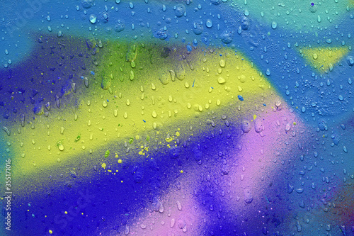 Abstract colored graffiti background with water droplets