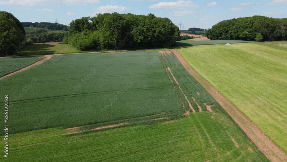 Flight over Farmlands on a sunny day - aerial photography by drone Flight over Farmlands on a sunny day - aerial photography by drone
