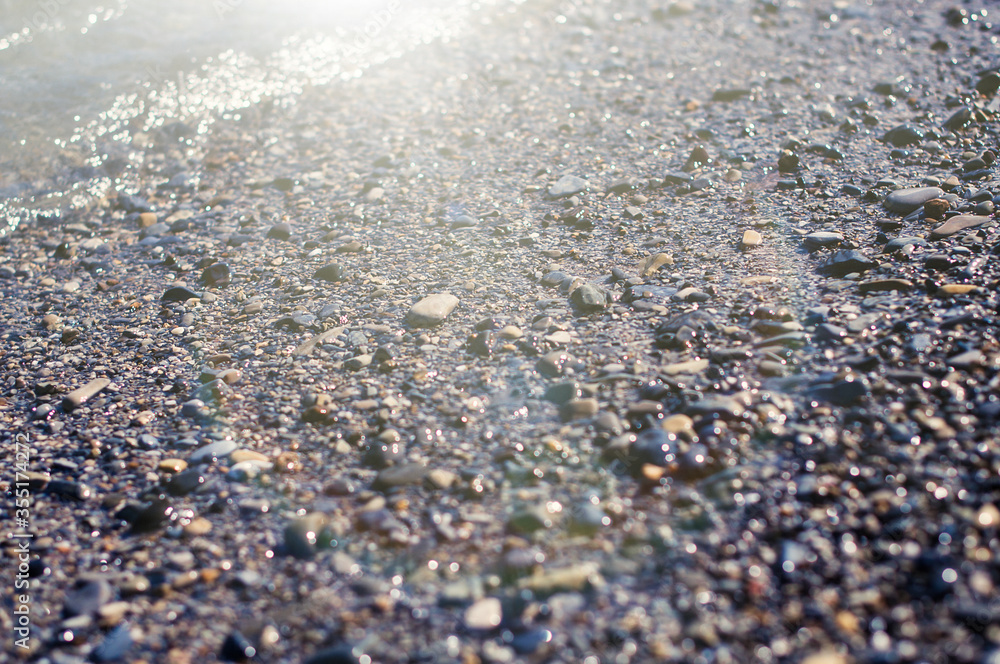 Sea pebble gravel beach. View from the top. Selective focus, toned colores. Sea pebble gravel beach. View from the top. Selective focus, toned colores.