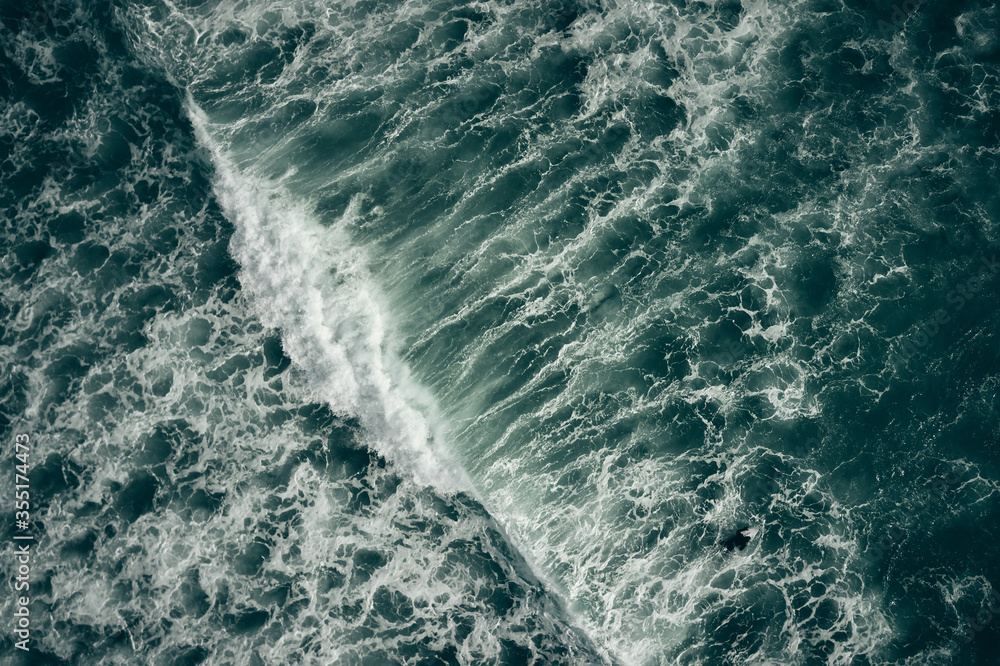 wave breaking over reef from above wave breaking over reef from above