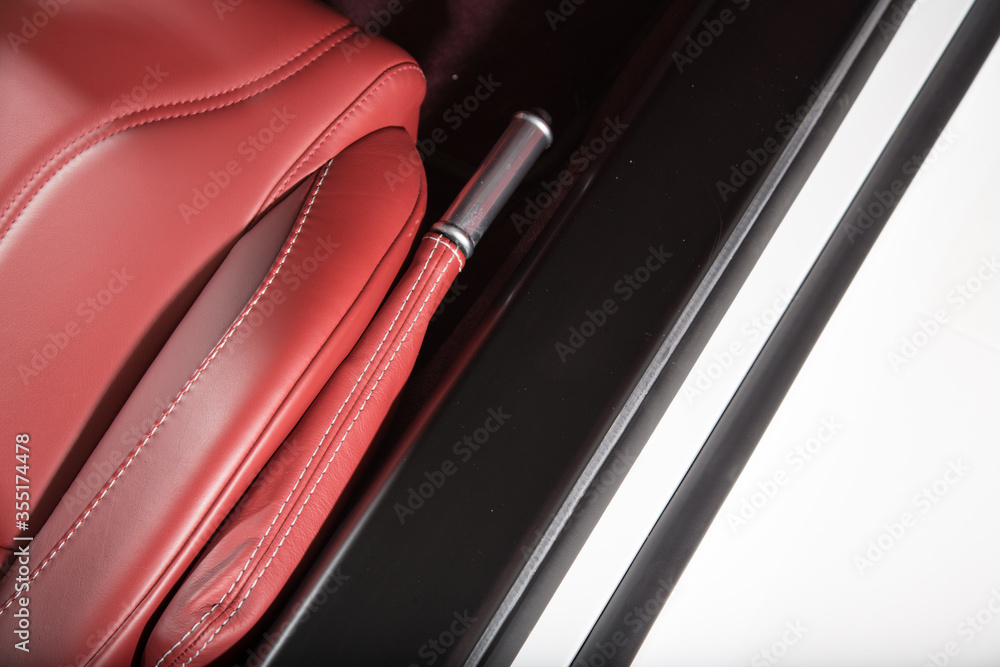 Red leather handbrake in ca car interior Red leather handbrake in ca car interior
