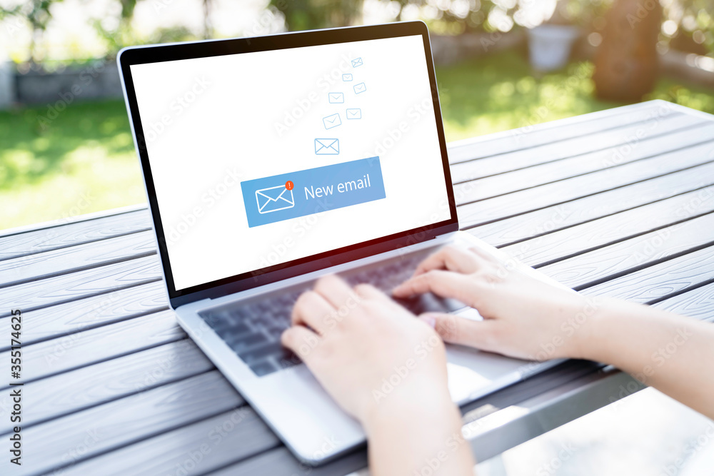 Person using a laptop computer with email communication connection message online and chat on social media with global letters concept. Person using a laptop computer with email communication connection message online and chat on social media with global letters concept.