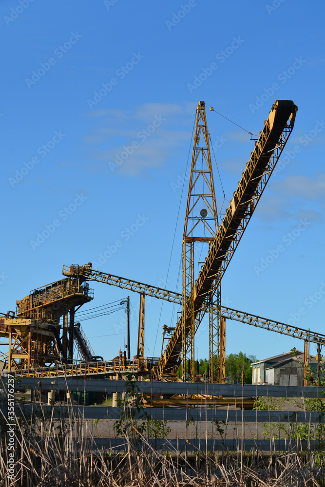 Conveyor belts sorting gravel at open pit quarry