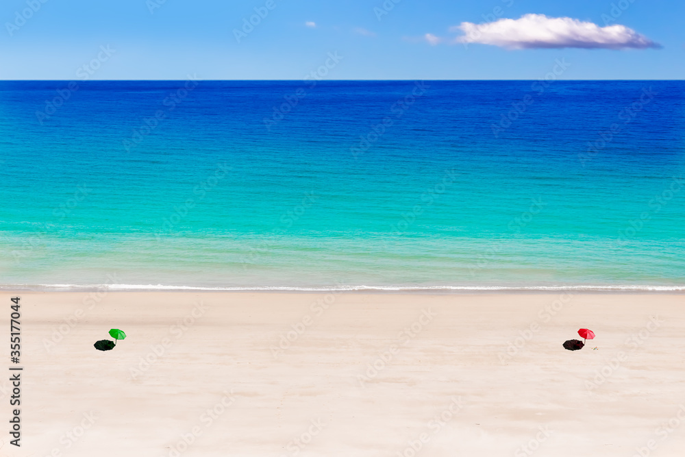 Vast Beach with Space between the Sunshades Vast Beach with Space between the Sunshades