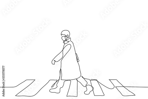 The full-length figure of a man dressed in a cloak and walking along a pedestrian crossing. A man alone walks at a wide pace, waving his arms wide. Can be used for animation.