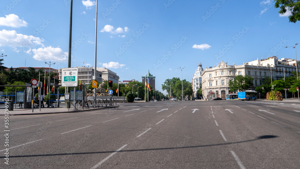 MADRID, SPAIN ,JUNE 05, 2020 : THE CASTELLANA STREET IN MADRID WITH THE TOWERS OF COLON IN THE BACKGROUND