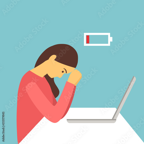 Exhausted female employee or manager at work sitting at the desk with head down and low battery icon above. Woman tired at office due to business problem. Work overload.