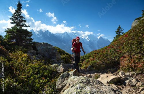A man hiking on the famous Tour du Mont Blanc near Chamonix, France. © sanderstock