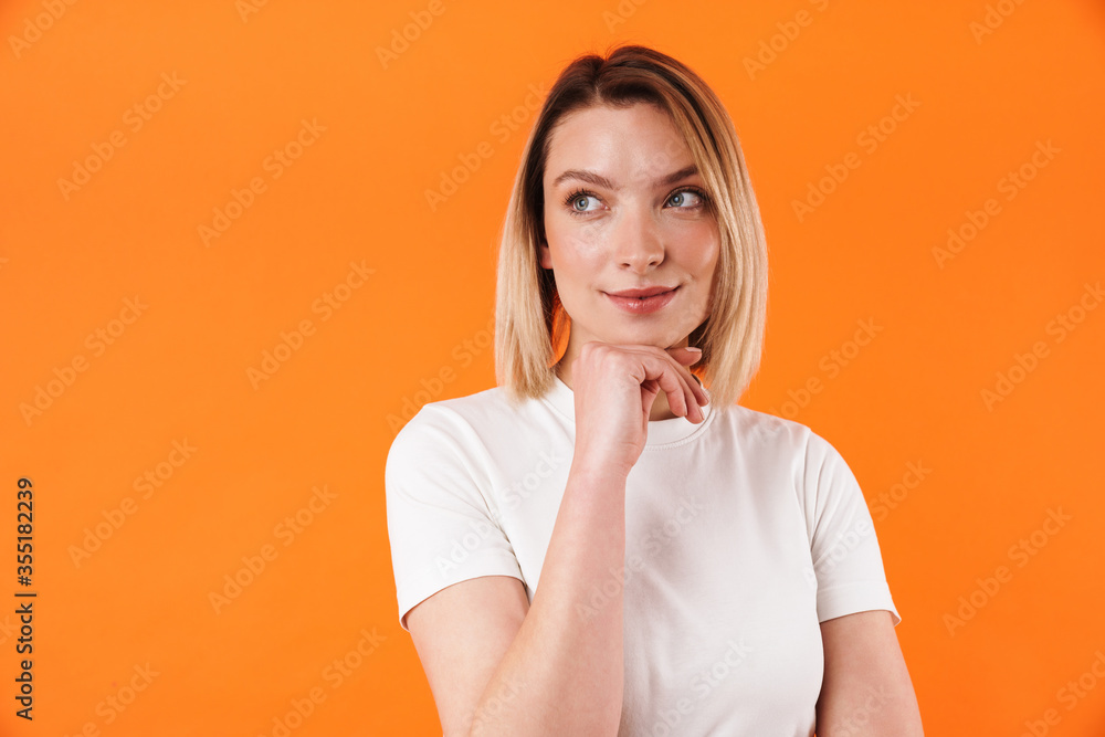 Image of pleased caucasian woman posing and looking aside Image of pleased caucasian woman posing and looking aside